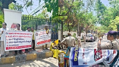 The image shows retired TGSRTC workers protesting at Bus Bhavan in RTC X Roads demanding the management to clear their arrears from 2017 and 2021 pay scales on Thursday, June 18, 2026.