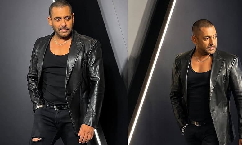 A stylish man wearing a black leather jacket and black shirt, posing confidently at the Siasat Daily even.