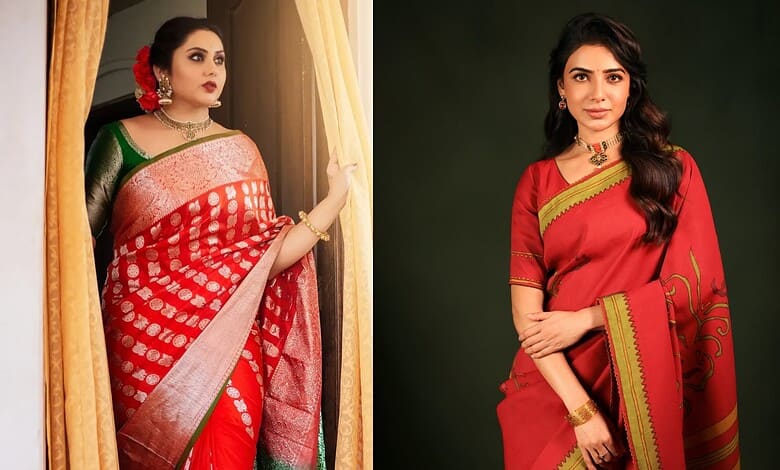 A woman in a red and green traditional saree looking out of a window with curtains.