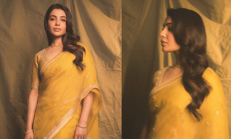 Samantha in a yellow saree at a movie event, looking elegant and stylish.