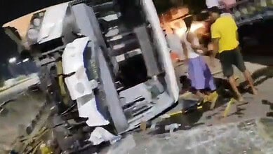 A bus overturns after an accident in Mancherial