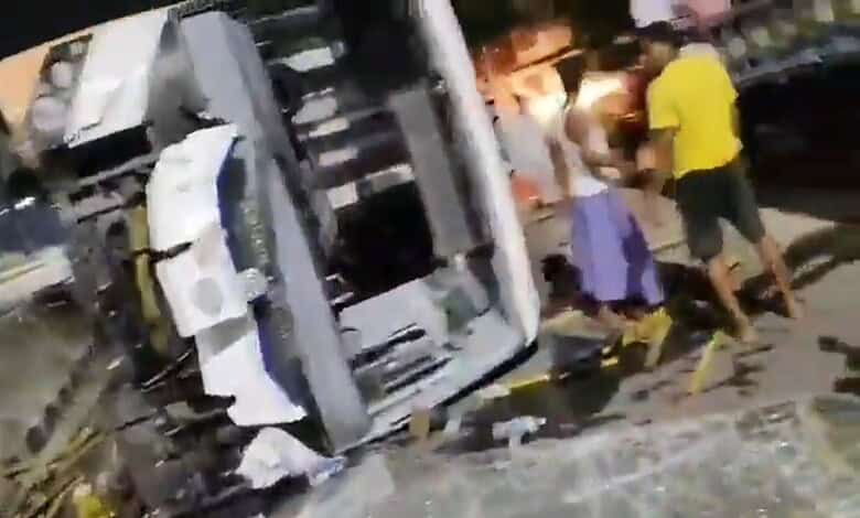 A bus overturns after an accident in Mancherial
