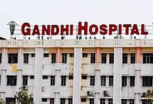 Gandhi Hospital building with prominent red signage in Hyderabad, India, serving as a major healthcare fa.