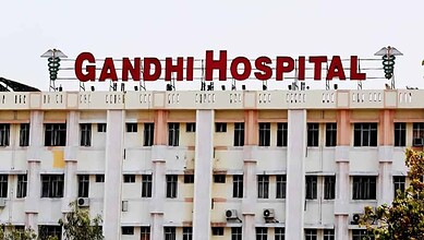 Gandhi Hospital building with prominent red signage in Hyderabad, India, serving as a major healthcare fa.