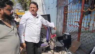 The image shows a local leader showing how the materials in the shops were being thrown out during the eviction at Fateh Darwaza in Doodhbowli on Thursday, June 11, 2026.