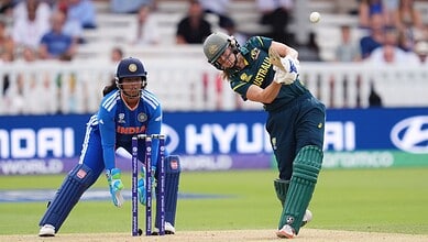 Australian female cricketer batting against India in a T20 match at the World Cup.