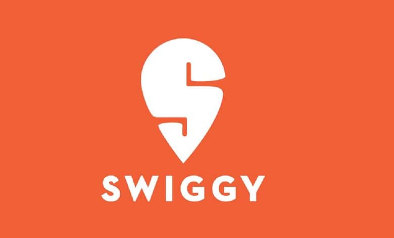 Swiggy logo on orange background, representing food delivery service in India.