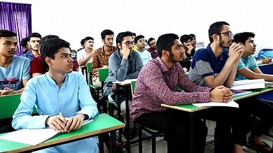 Students attentively listening in classroom at MS Education Academy for TG LAWCET preparation.