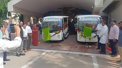New electric shuttle buses inauguration at Siasat Daily office with officials and guests.