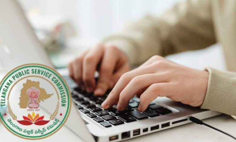 Close-up of hands typing on a laptop with Telangana Public Service Commission logo in the background.