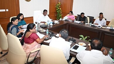 Officials and educators in a meeting discussing Gurukul degree colleges and UGC pay scale.
