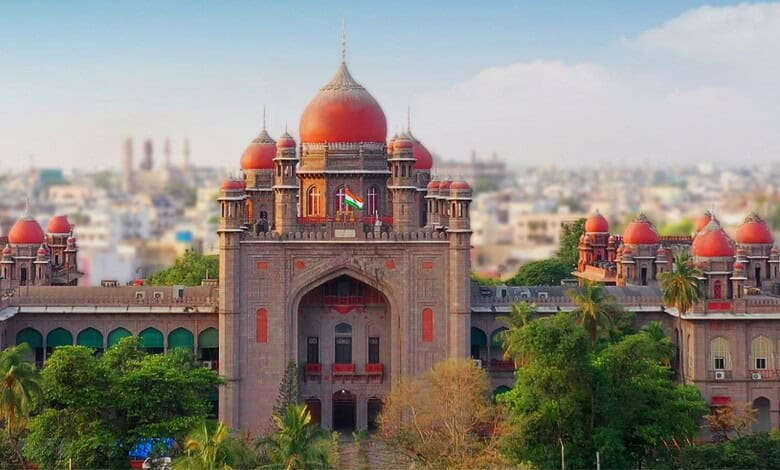 Majestic Hyderabad palace with red domes and lush greenery in the foreground.
