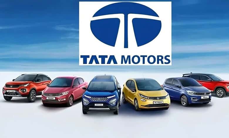 Tata Motors logo with five different Tata car models in front, showcasing the brand's diverse vehicle lin.