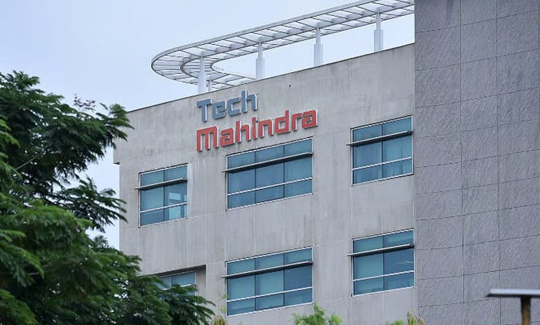 Tech Mahindra office building with company logo on the facade in an urban setting.