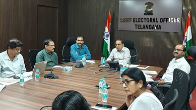 Telangana Chief Electoral Officer meeting with officials in a conference room.