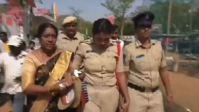 Sub Inspector Amreen is helped by colleagues after collapsing