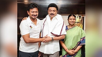 Celebration of a successful event with smiling individuals, including a man in white shirt and a woman in.