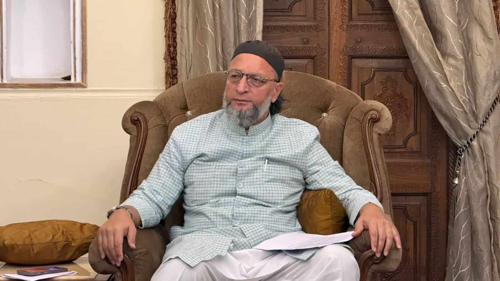 The Siasat Daily: Man in traditional attire sitting on an ornate armchair in a formal setting.
