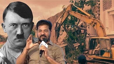 A man speaking into a microphone in front of a construction site with a large image of a historical figur.