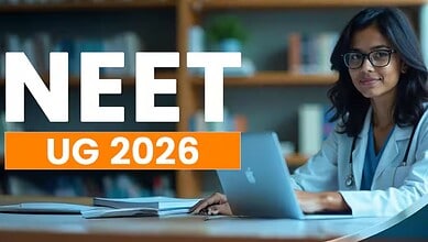 NEET UG 2026 exam preparation: Female student studying with laptop and books in a library setting.