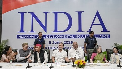 Prominent Indian leaders at a conference promoting national development and inclusion, seated at a table.