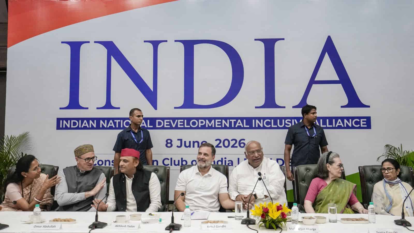 Prominent Indian leaders at a conference promoting national development and inclusion, seated at a table.