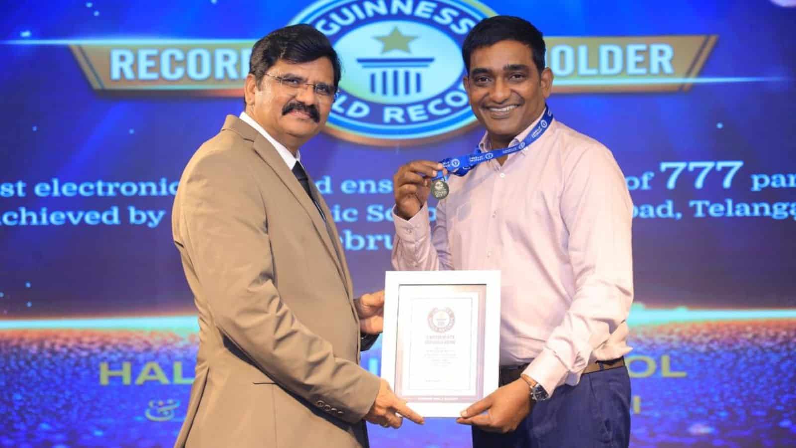 Goya Veparla (Right) receives the Guinness certificate.