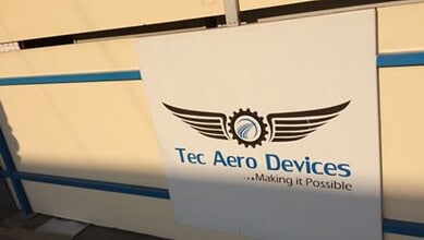 Tec Aero Devices logo with wings and gear symbol, representing aerospace innovation and engineering excel.