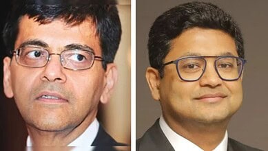Senior male professional wearing glasses, formal attire, in a close-up portrait.