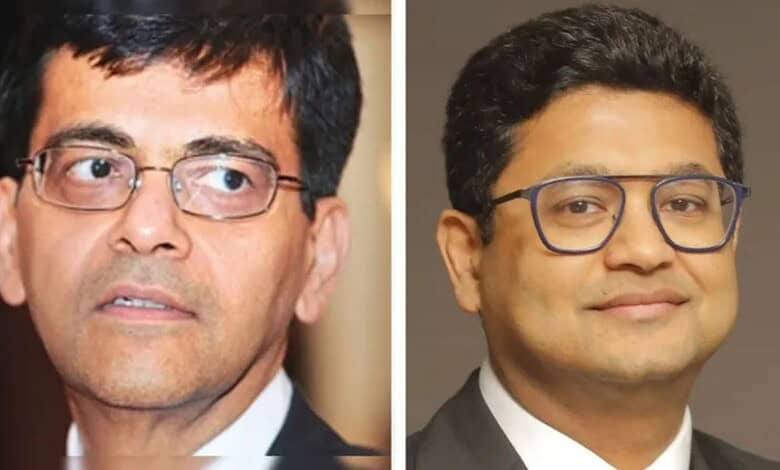 Senior male professional wearing glasses, formal attire, in a close-up portrait.