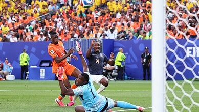Ivory Coast's Dialo scores a goal against Ecuador