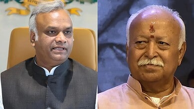 Priyank Kharge and Mohan Bhagwat in a formal setting, engaged in a discussion.