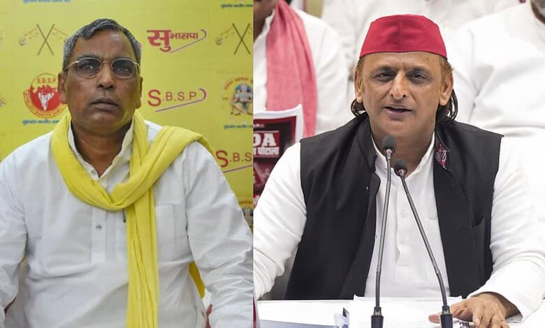 UP minister Rajbhar speaking at a press conference with a yellow background.
