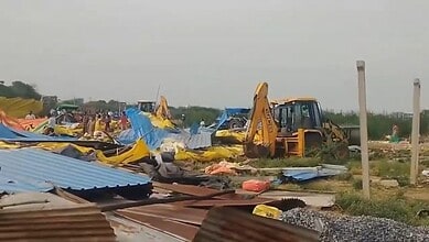 Demolition of huts in Hanamkonda during anti-encroachment drive with excavators and debris.