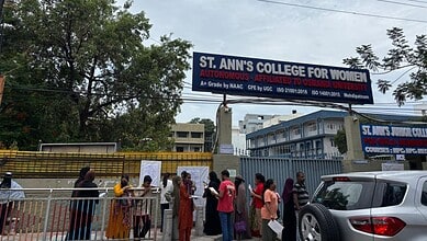 Students and parents gather outside St. Ann's College for Women in Hyderabad.