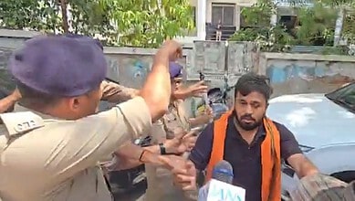 Protest outside Ahmedabad NEET centre over hijab and sacred thread issues.