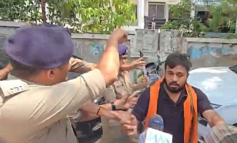 Protest outside Ahmedabad NEET centre over hijab and sacred thread issues.