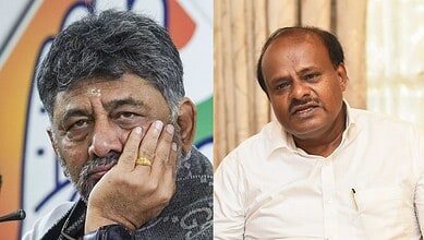 Karnataka political leaders H.D. Kumaraswamy and another politician in discussion.