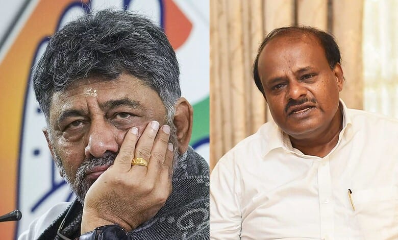 Karnataka political leaders H.D. Kumaraswamy and another politician in discussion.