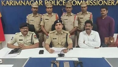Police officers and officials at a press conference on dacoity case in Karimnagar.