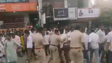 Police beat students during a protest at Adibatla