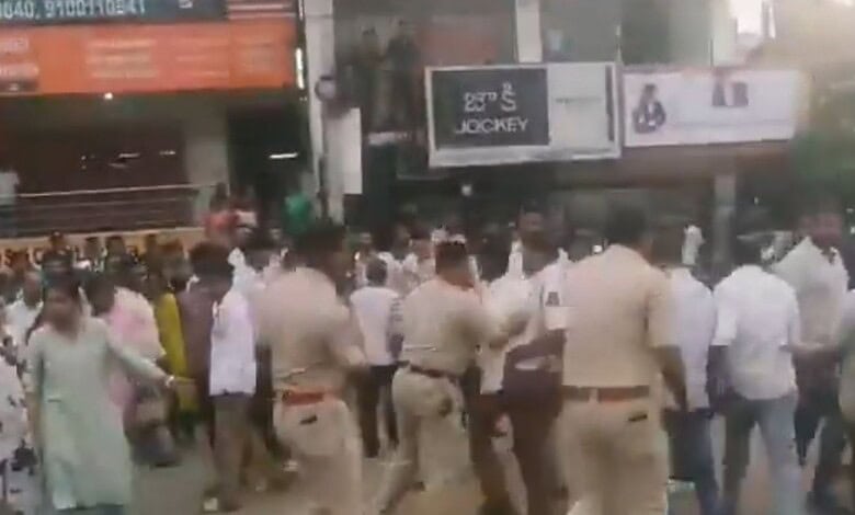 Police beat students during a protest at Adibatla