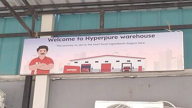 Welcome to Hyperpure warehouse with food safety and quality assurance signs.