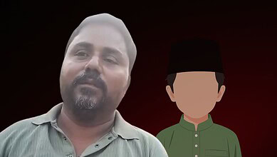 Photograph of a man with a beard and a young boy in traditional attire against a dark background.