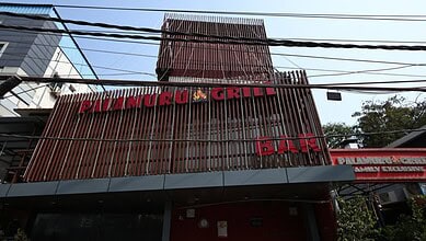 Palamuru Grill restaurant exterior with wooden facade and signage in Hyderabad, India.