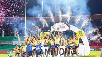 Hyderabad Heroes celebrate winning Rugby Premier League with fireworks and trophy in stadium.