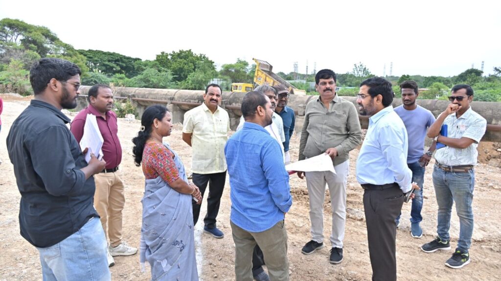 Officials and engineers inspecting water infrastructure at Hyderabad water board site.