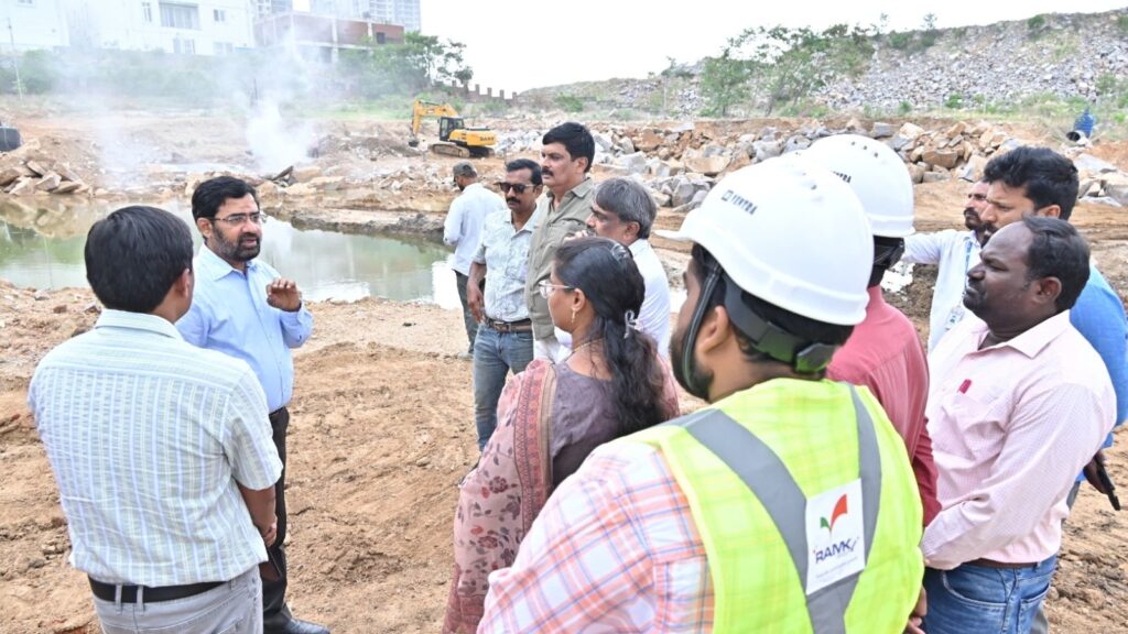 Officials and engineers inspect a water project site at Hyderabad water board.