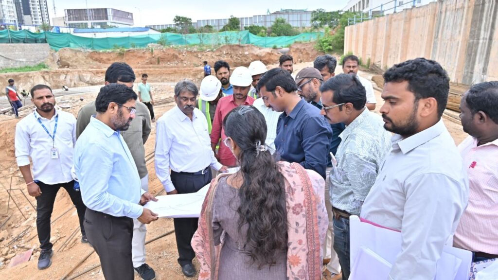 Group of officials inspecting construction site for Hyderabad water board project.