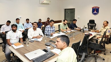 Cyberabad Police review flood-prone areas ahead of monsoon in a meeting room.